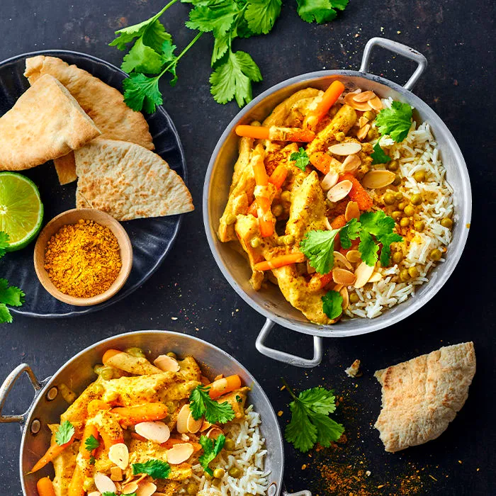Image représentant Curry de poulet aux Petits Pois et Carottes, coriandre et amandes effilées torréfiées